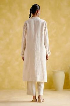 Beige linen tunic with khodi work on the collar and cuffs. Paired with a pant. - Aza Fashions Traditional Linen Workwear Sets, Traditional Linen Sets For Workwear, Elegant Linen Straight Kurta Sets, Linen Straight Kurta Set For Summer, Summer Linen Straight Kurta Set, Elegant Linen Kurta For Spring, Summer Linen Sets With Straight Kurta, Fitted Linen Straight Kurta Set, Festive Long Sleeve Linen Sets