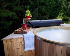 a hot tub sitting on top of a wooden table