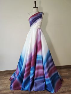 a dress on a mannequin in front of a white wall and wooden floor