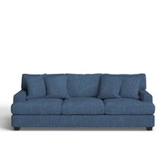 a blue couch sitting on top of a white floor