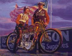 two people standing next to a motorcycle with an american flag in the backgroud