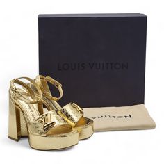 - Gold. - Metallic Ayers Leather (Snakeskin). - Lambskin Lining. - Leather Outsole. - 12 Cm / 4.7-Inch Heel With 9.5 Cm / 3.7-Inch Comfort. - Lv Accessory. - Made In Italy. Size: 35 Condition: Brand New With Box. Minor Scuffs As Shown In The Pictures. Luxury Gold Platform Sandals, Luxury Patent Leather Sandals, Luxury Patent Leather Sandals With Block Heel, Luxury Leather Heels, Luxury Heels With Heel Strap, Louis Vuitton Pumps, Louis Vuitton Heels, 7 Inch Heels, Shoes Louis Vuitton