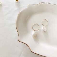 These Gorgeous Pearl Hoop Earrings Will Be Your New Favorite Earrings. They're Perfect For Any Occasion And They Are Easy For Dress Up And With Your Skinnies. Features A Baroque Freshwater Pearl With High Luster, Suspended On A 14k Gold Filled- Materials Durable For Everyday Wear. Classic Small Hoops With 14k G.F And Genuine Freshwater Pearls Measures Approx. 3/4" Diameter Lightweight Handcrafted Premium Collection Brand: Flint J. Nickel-free White Hoop Pearl Earrings, White Small Hoop Pearl Earrings Single Earring, White Pearl Small Hoop Earrings With Ear Wire, White Small Hoop Pearl Earrings With Ear Wire, White Pearl Earrings For Everyday, White Small Hoop Pearl Earrings, Dainty White Pearl Small Hoop Earrings, Everyday White Round Pearl Earrings, Everyday White Hoop Pearl Earrings