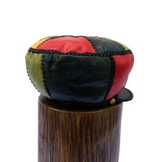 Size LARGE / Height 6 inches Rim 56 cm or 22 inches (to go over your head) Rasta Leather Hat made from variations of Red Gold Green and Blue leather. GENUINE LEATHER RASTA CROWN Prince Crown Hand Crafted Rasta Hat made from Genuine Designer Leather ☼ Hand Crafted and Hand Stitched ☼ 100% Leather exterior and lacing ☼ Stylish and useful, versatile and comfortable. ☼ Product of Jamaica, made in Jamaica by Jamaicans Pick one to fit your personality, your wardrobe... or gift one to someone special a Retro Leather Cap, Handmade Artisan Leather Hat, Artisan Handmade Leather Hat, Vintage Handmade Leather Hat, Handmade Vintage Leather Hat, Rasta Hat, Leather Crown, Prince Crown, Leather Hat