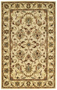 a beige rug with an ornate design on the top and bottom, surrounded by gold trimming