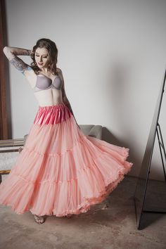 This is the petticoat to shame all others. Delight in the fluff without the crisp, stiff feel typical of most. One Size fits up to 10. Notes:This style does have bulk at the waist, making it a good match for only natural-waisted or empire gowns with gathers at the waist. Approx 60 day delivery. Crinoline Tulle Skirt Petticoat, Spring Full Skirt Crinoline Petticoat, Can-can Crinoline Petticoat With Tiered Skirt, Can-can Crinoline Tiered Petticoat, Stretch Ruffle Petticoat Skirt, Stretch Tiered Petticoat With Attached Cancan, Fitted Lined Skirted Petticoat, Fitted Full Skirt Petticoat With Ruffles, Voluminous Ruffled Crinoline Petticoat