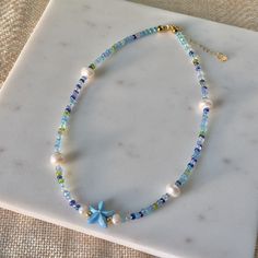 Under The Sea Freshwater Pearl Necklace | Summer Necklace | Beach Jewelry | Beaded Necklace | Coconut Girl Aesthetic | Seed Bead Jewelry by myearthyaura on Etsy Cheap Beach Jewelry With Heart Beads, Cheap Beach Jewelry With Gemstone Beads, Cheap Dangling Beads Necklace For Beach, Cheap Beaded Beachy Necklaces For Beach Season, Cheap Beaded Chain Necklaces For Beach, Cheap Blue Necklaces For The Beach, Cheap Silver Beaded Jewelry For The Beach, Cheap Handmade Summer Jewelry, Cheap Beach Necklaces With Spacer Beads