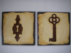 two pieces of art made to look like they have keys on them, one is brown and the other is black