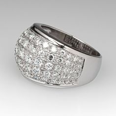 This wonderful domed ring is accented with seventy-five (75), bead set, round brilliant/single cut diamonds. The ring measures 13.7mm at the top, rises 5.9mm above the finger, tapering to 4.8mm wide and 1.0mm thick at the base of the shank. This ring is currently a size 6.5 and resizing is not recommended. Diamond White Brilliant Cut Dome Ring, Domed Diamond Ring In White Gold, Luxury Dome Ring With Diamond Cut For Formal Occasion, Luxury Wide Band Ring With Single Cut Diamonds, Luxury Dome Ring With Diamond Cut For Formal Events, Domed White Gold Diamond Ring, Formal Round Dome Ring With Pave Setting, Luxury White Gold Wide Band Ring With Brilliant Cut, Formal Domed Diamond Ring Fine Jewelry