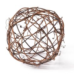 a ball made out of branches on a white background