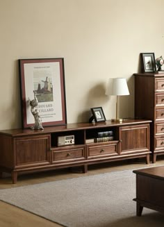 a living room scene with focus on the coffee table and entertainment center, along with an animal statue