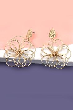 A fusion of floral beauty and modern design that will elevate your style and add a touch of sophistication to any outfit. These exquisite earrings feature intricately crafted matte flowers that are delicately entwined, creating a unique and elegant accessory.Product Details:length: 2.5" width: 1.75" earring back: Postmetal finish: gold, rhodium Platingproduct: Lead & Nickel Compliantanti-tarnish: Double E-coating Flower Dangle Earrings, Post Metal, Sunglass Chain, Wall Accessories, Huggie Hoop Earrings, Elegant Accessories, Color Calibration, Color Collection, Light Photography