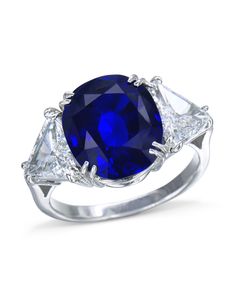 Exquisite oval sapphire and diamond ring made in platinum holding a 7.95ct natural Burmese blue sapphire with two trillion cut diamonds on the side. Female Rings, Favorite Engagement Rings, Jewelry Knowledge, Blue Diamond Ring, Sapphire And Diamond Ring, Women's Rings, Diamond Jewelry Designs, Expensive Jewelry, Beautiful Engagement Rings