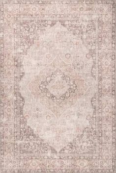 an antique style rug in grey and beige tones with a medallion design on the center