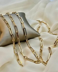 "18k Gold Paperclip Necklace ,18\",5 mm, 8.49 gr . 18k Gold paperclip Necklace ,22\",5 mm, 10.12  gr . 18k Real Gold paper clip Bracelet ,7.5\" ,5 mm, 3.71 gr . Priced to sell! Compare our prices to other similar sellers! Arrives in a GIFT BOX and includes FREE SHIPPING within the USA and Canada. International shipping is available at the most economical rates on ETSY. I HAVE BEEN IN THE JEWELRY BUSINESS ALL MY LIFE. I am a second -generation family member making gold and jewelry. Please feel free to ask me any questions - Always happy to help! Fast Replies to messages! Superior Quality and Best Prices!" Yellow Gold Paperclip Chain Necklace With Oval Links, Yellow Gold Oval Link Chain Necklace With Paperclip Chain, Gold Oblong Paperclip Chain Necklace, Formal Paperclip Bracelet With Cable Chain, Formal Paperclip Cable Chain Bracelet, Formal Paperclip Chain Necklace, Yellow Gold Paperclip Link Bracelet, Yellow Gold Paperclip Chain Necklace, Elegant Paperclip Link Bracelet With Figaro Chain