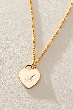 Just as effortless as it is elegant, this stunning necklace features a heart-shaped pendant with gorgeous cursive engraved initial for the ideal finishing touch. * 14k Gold Filled wheat chain * Personalized, laser engraved, 14k Gold Filled 12x14mm heart charm * Length: 18" * 5 days of production | Set & Stones Personalized Alice Necklace at Free People in Gold Elegant Heart Pendant Necklaces With Charms, Elegant Heart Pendant Necklace With Charms, Elegant Heart Shaped Charms Necklace, Elegant Heart-shaped Charms Necklace, Elegant Heart-shaped Charm Necklace, Elegant Heart-shaped Necklace With Charms, Elegant Valentine's Day Necklaces With Charms, Elegant Engraved Nameplate Initial Necklace, Heart Charm Initial Pendant Necklace Gift For Her