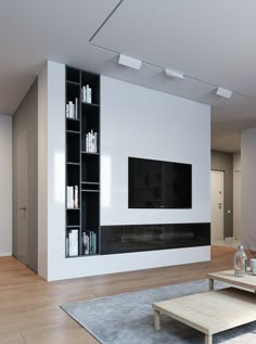 a modern living room with white walls and wood flooring