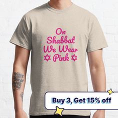 a man wearing a t - shirt that says, on shabbat we wear pink buy 3 get 15 % off