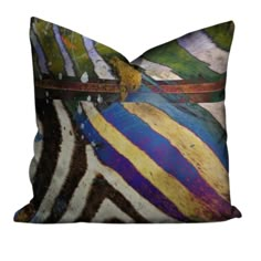 a pillow with an abstract design on the front and back of it, which is multicolored