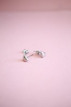 The cutest stud to ever exist! Perfect for all ages, all year round, to give your ears a little love! This cute stud works great in a lobe piercing as well as helix piercings too! It's made out of stainless steel so it's incredibly high quality and works for even the most sensitive ears. This earrings is basic you need in your jewelry box asap! This stud earring is .2 inches in length. It is made of stainless steel posts so it is nickel free, hypoallergenic, and the best of the best for even the Trendy Hypoallergenic Sterling Silver Piercings, Silver Heart Cartilage Earrings As Gift, Trendy Silver Hypoallergenic Heart Earrings, Trendy Internally Threaded Cartilage Earrings As Gift, Dainty Heart Shaped Piercings For Gifts, Trendy Hypoallergenic Sterling Silver Heart Earrings, Heart Charm Piercings For Gift, Hypoallergenic Heart Cartilage Earrings For Everyday, Heart Charm Piercings As Gift