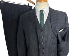 Circa 1950s ~ Vintage Brooks Brothers Wool Flannel 3-piece Sack Suit Suit - size 38 Regular  ~ Union made in USA Jacket: ~ 3-button front  ~ Buttonhole lapel ~ Flapped pockets ~ Single back vent ~ Single interior pocket Vest: ~ 6-button front ~ Four jetted pockets ~ Buckle-back waist Trousers: ~ Flat front ~ Watch pocket ~ Talon zipper ~ Cuffed hems Perhaps the best vintage Brooks garment I've ever seen. This 3-piece sack suit is in immaculate condition. Truly a time-capsule worthy piece. Color: Fitted Vintage Sport Coat With Button Closure, Vintage Sport Coat With Notch Lapel And Button Closure, Vintage Fall Sport Coat With Double-needle Stitching, Vintage Single-breasted Sport Coat With Flat Front, Sack Suit, Jacket Sport, Vintage Single-breasted Plaid Sport Coat, La Traviata, Watch Pocket