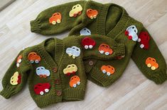 three knitted sweaters with cars on them