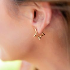 Be the envy of all your friends with these stunning Gold Star Huggie Earrings! Perfect for a special night out, these cuties have the star power to show off your unique style. Let your light shine! 🌟 From April 24, 2024 – December 31, 2024, Golden Thread will donate 20% of sales from each item in the Wish Collection, both online and in-store, to Make-A-Wish. Starburst Earrings As Gift, Trendy Star Embellished Jewelry For Parties, Trendy Star-embellished Party Jewelry, Trendy Star Embellished Party Jewelry, Gold Star Hoop Earrings For Party, Gold Star-shaped Hoop Earrings For Party, Trendy Hoop Earrings With Star Charm For Party, Star Charm Earrings For Party, Trendy Party Hoop Earrings With Star Charm