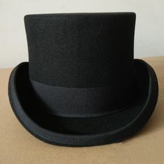 Welcome to our standalone platform, where timeless elegance meets sophistication - the Top Hat. Whether for formal occasions or personal style statements, this classic high-crowned hat is your ultimate choice. Ensure to order your regular hat size, as these hats fit true to size with more than enough room for comfort. Experience Elegance: Theater Quality Mens Top Hat Elevate your formalwear with our meticulously crafted mens top hat, designed for serious collectors and lovers of sophisticated style. Indulge in the theater-quality experience brought to you by the 100 percent wool felt body and smooth leather sweatband, making this top hat a must-have for those who appreciate the finer things in life. Timeless Tradition: Traditional Style Redefined Immerse yourself in the elegance of an earl Hat Stands, Formal Attire, Hat Band, Top Hat, Grey Fashion, Sophisticated Style, Hat Sizes, Getting Old, Formal Occasion