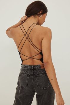 Spaghetti Strap Back Detail Top Black | NA-KD Chic Crop Top With Built-in Bra And Strappy Back, Black Halter Neck Top With Built-in Bra, Black Halter Top With Built-in Bra For Spring, Chic Cross Back Tie Back Top, Chic Cross Back Top With Tie Detail, Black Tank Top With Built-in Bra And Strappy Back, Black Tops With Built-in Bra And Strappy Back, Black Top With Built-in Bra And Strappy Back, Summer Halter Top With Crisscross Straps And Cross Back