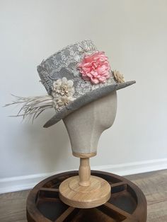 This is an amazing tophat that no one else will be sporting during your special event!! This would be positively perfect for any renaissance festival costumes that needs a little extra ooomph! With beautiful sparkling silver fabric, to the unique lace and florals, this is a stunning hat that will definitely be a center point of conversation! Condition: One-of-a-kind, New, one size fits most! Center Point, Festival Costumes, Silver Fabric, Costume Hats, Wedding Hats, Top Hat, Hat Fashion, Special Event, Wedding Accessories