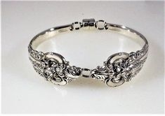 "Solid Sterling Silver ~ This Bracelet is a heavier chunky Bracelet because of the pattern. If you like a Bracelet with substance this may the one for you.. Finish ~ Shiny Pattern Name Grand Baroque ~ Introduced in 1941 by Wallace. My goal is to make a perfect fitting bracelet for you. To do that, I need an exact wrist measurement. The measurement must be snug---not too loose or too tight. The measurement needs to be taken just above the wrist bump (elbow side). Please use the demo picture as a Silverware Bracelets, Vintage Hallmarked Sterling Silver Bracelet Gift, Victorian Silver Hallmarked Cuff Bracelet, Victorian Hallmarked Silver Cuff Bracelet, Silver Spoon Bracelet, Spoon Bracelet, Chunky Bracelet, Twist Style, Chunky Bracelets