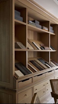 an open bookcase with many books on it