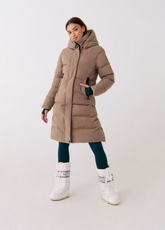 Achieve full-body warmth with this longline city jacket. Featuring deep pockets and inner backpack straps for easy portability wherever you go. Winter Travel Outerwear With Zipper Closure, Winter Travel Outerwear With Adjustable Hood, Functional Outerwear With Zipper For Travel, Functional Travel Outerwear With Zipper Closure, Functional Down Parka For Fall, Functional Fall Parka With Zipper Closure, Functional Travel Outerwear With Double-lined Hood, Sporty Outerwear With Functional Pockets For Travel, Winter Nylon Outerwear With Multiple Pockets