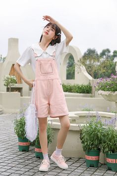 Pastel toned overalls with a roomy fit and embroidered flowers along the bib pocket, button up sides, side pockets and back pockets. S: 32" waist, 40" hips, 12" rise, 25" thighs, 6" inseamM: 33.5" waist, 41.5" hips, 12" rise, 26" thighs, 6" inseamL: 35" waist, 43" hips, 12" rise, 27" thighs, 6" inseam How to attach buckles:Slide the rectangular buckle on first, followed by the T-shaped buckle. Overall straps will hold on its own as such or you can slide the free end back into the rectangular buc Overall Straps, Short Overalls, School Clothes, Pink M, Daisy Chain, Shoe Gifts, Overall Dress, Pink Shorts, Sweater Blouse