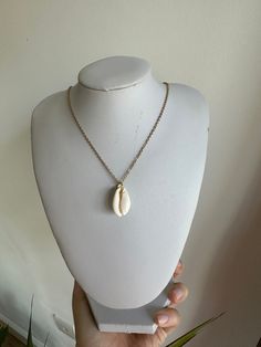 Cute seashell necklace. Available in Gold and Silver chain Approx 18 inch Shell Necklace With Clavicle Chain For Gift, Shell Necklace With Clavicle Chain As Gift, Elegant Chain Jewelry For Vacation, White Chain Necklace For The Beach, Gift Shell Necklace With Clavicle Chain, Elegant Vacation Jewelry With Chain Detail, Shell Clavicle Chain Necklace For Beach, Shell Clavicle Chain Jewelry For Beach, Shell Necklaces With Adjustable Chain