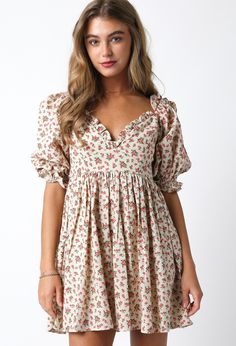 Elevate your style with our 'August Bloom Mini Dress'. This timeless dress features charming puff sleeves and a delicate ruffle hem, adding a touch of femininity to your look. The beautiful floral pattern adds a pop of color, making it the perfect choice for any occasion. Complete your wardrobe with this versatile and stylish mini dress. Content & Care: Self: 100% Linen Lining: 100% Rayon Hand wash cold Cotton Ruffle Hem Feminine Dress, Brunch Floral Print Fitted Puff Sleeve Dress, Fitted Floral Print Puff Sleeve Dress For Brunch, Fitted Puff Sleeve Dress With Floral Print For Brunch, Cottagecore V-neck Dress With Ruffles, Feminine Puff Sleeve Dress With Ruffles For Garden Party, Feminine Ditsy Floral Print Dress For Fall, Chic Spring Floral Puff Sleeve Dress, Feminine Ditsy Floral Print Dress With Square Neck