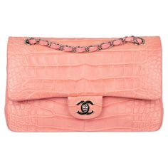 This Chanel Medium Double Classic Flap Bag is truly a rare gem. This model is no longer produced, making it a must-have item for any bag collector. Constructed from coral pink matte crocodile leather and silver tone hardware, it is the perfect combination of luxury and style. Brand: Chanel Product: Medium Double Classic Flap Bag Size: L 25.5 X H 17 X 7 Cm Colour: Coral Pink Material: Matte Crocodile Leather Hardware: Silver-Tone Series: 20 | 2014 - 2015 Condition: Excellent: The product has been worn and shows minimal signs of usage. It may have minor cosmetic imperfections, including minor stains, abrasions and scratches. Accompanied By: Chanel Box, Dust Bag & Authenticity Card Chanel Crocodile Bag, Pink Bags, Rosa Coral, Chanel Box, Pink Things, Classic Flap Bag, Crocodile Bags, Leather Hardware, Jane Birkin