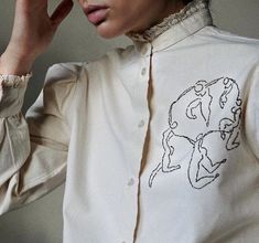 Hand embroidered beige lace shirt. Lace collar and details. Our new drop of custom made blouses. Organic cotton, feminine cut and hand embroidery with love. Slooow hands takes it to the new level, making your look even more perfect and unique. Henri Matisse - pencil sketch. Oversized. Wide sleeves. Measurements (cm) M/L size: Shoulders: 43, Sleeve: 60, Bust: 103, Blouse length: 58. Burned Hat Design, Dusty Pink Blouse, Fun Sewing Projects, Textiles Art, Reworked Vintage, Art To Make, Dress Idea, Hat Design, Shirt Embroidery