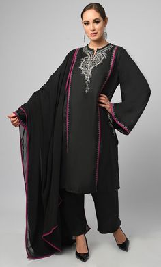 Embroidered black salwar phiran set. It is a detailed and intricate form of contrast piping and zari work embroidered on sleeves, pockets and neck, colorful stitches to create patterns and designs on the fabric of the garment. It is a popular choice for special occasions, such as weddings and festivals. Salwar suits are more modern and casual alternative to the traditional salwar kameez Fabric Details TOP Pure polyster poplin with zari work detailing on neck and sleeves, Full loose sleeves Dupat Festive Black Palazzo Set With Zari Work, Black Palazzo Set With Zari Work For Diwali, Diwali Black Palazzo Set With Zari Work, Bollywood Style Black Palazzo Set For Festive Season, Festive Bollywood Style Black Palazzo Set, Bollywood Style Black Palazzo Set For Festive Occasions, Black Zari Work Palazzo Set For Festivals, Black Palazzo Set With Zari Work For Festivals, Festive Bollywood Black Palazzo Set