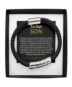 a black leather bracelet with the words to our son on it in a white frame