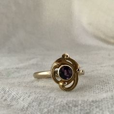 Art Deco ring / 14 karat amethyst ring / 14k solid gold vintage ring This gorgeous 14 karat yellow gold art nouveau ring features a 4 mm round amethyst in a yellow gold bezel setting. This art nouveau ring was redesigned from a stick pin and converted into a ring. The vintage pin was added to a half round 2.0 mm band perfect for stacking with other rings. Another fabulous way to wear these vintage rings are three or four across one hand. All stones and settings have been checked and tightened by Vintage Amethyst Ring, Gold Vintage Ring, Amethyst Ring Vintage, Art Nouveau Ring, Amethyst Gem, Purple Band, Deco Ring, Gold Hands, Gold Art