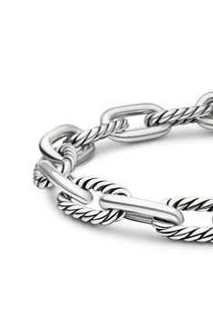 This chunky chain bracelet features alternating twisted and smooth links made of sterling silver and adds polished shine to any wrist stack. 7 1/2" length Push-clasp closure Sterling silver Imported Classic White Gold Bracelets With Chunky Chain, Classic White Gold Bracelet With Chunky Chain, Classic White Gold Chunky Chain Bracelet, Classic Chunky Chain Bracelet, Classic Sterling Silver Bracelet With Chunky Chain, Classic Sterling Silver Chunky Chain Bracelet, Classic Sterling Silver Bracelet With Chunky Oval Links, Classic Silver Cable Chain Bracelet, Classic Sterling Silver Bracelet With Cable Chain