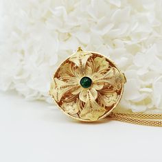 Inspired by Yun Boutique logo, this Auspicious Flower pendant embraced ancient Chinese filigree jinlay art with classic modern elegance. Adjustable chain can be styled with difference collar shapes. Not to be confused with regular gold plating, our vermeil is a thick layer of 18k solid gold on sterling silver. Chinese filigree inlay art is a delicate kind of jewelry metalwork, usually of twisted threads made of gold, silver, and copper, soldered together and arranged in artistic motifs with moun Spiritual Filigree Medallion Necklace, Spiritual Medallion Necklace With Filigree Details, Spiritual Medallion Necklace With Filigree, Spiritual Medallion Filigree Necklace, Elegant Locket Jewelry For Festivals, Elegant Festival Locket Jewelry, Spiritual Filigree Flower Pendant Necklace, Spiritual Round Pendant Necklace With Filigree, Engraved Temple Jewelry As A Gift