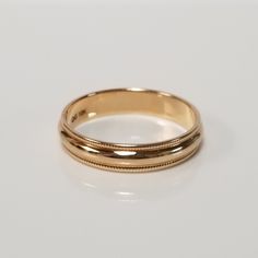 Thanks for shopping our vintage estate store. We tend to sell well below wholesale and truly hope you enjoy all of our items. Many of the items are one of a kind, so please enjoy scrolling through the pictures and hopefully something will catch your eye. Brown spots are from the camera or reflections. Estate 10k yellow gold 4mm wide band with detailed edge. Ring size: 5.5 or 7 Width: 4mm Weight: 2.15 grams 7 Weight: 1.76 grams 5.5 Marked 10k and it's a nice wide band. Classic Wedding Jewelry With Hallmarks, Vintage Rings With Classic Design, Gold Milgrain Jewelry For Wedding, Heirloom Gold Bands For Anniversary, Classic Gold Jewelry For Wedding, Vintage Decorative Bands For Anniversary, Vintage Yellow Gold Bands For Anniversary, Vintage Yellow Gold Anniversary Bands, Vintage 14k Gold Wedding Bands