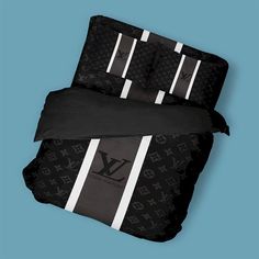 black and white bedding set with monogrammed stripes on the bottom, two matching pillow cases