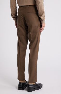 Tailored from subtly patterned wool, these all-occasion dress pants feature classic flat-front styling and a mid-rise fit that stays slim through the legs. 30 1/2" inseam; 13" leg opening; 10" front rise; 15 1/2" back rise (size 48EU) Zip fly with hook-and-bar closure Front slant pockets; back welt pockets Partially lined Unhemmed 100% wool Dry clean Imported Slim Fit Brown Bottoms For Business, Slim Fit Dress Pants With Welt Pockets For Fall, Brown Slim Fit Dress Pants For Fall, Slim Fit Dress Pants With Straight Hem For Fall, Slim Fit Business Pants For Fall, Business Slim Fit Pants For Fall, Fall Slim Fit Dress Pants With Straight Hem, Fall Business Slim Fit Pants, Fitted Brown Business Bottoms