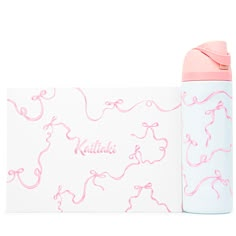 a pink and white bottle next to a card with the word kahlua on it