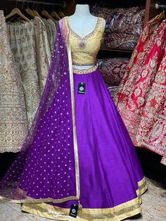 Violet purple skirt paired with contrasting golden zardozi and stone work blouse and net sequins butti dupatta. Fabric: Raw Silk This outfit can be customized in multiple colors and specific to client measurements. 90 days of production time is required and are for bulk orders only! Orders are processed in store only! Final fittings/alterations not included. Minimum Order Quantity- 4 pieces Purple Chanderi Anarkali Set For Reception, Purple Chanderi Sharara For Reception, Purple Art Silk Sharara With Dori Work, Purple Raw Silk Dupatta With Gota Work, Purple Raw Silk Traditional Wear With Gota Work, Traditional Drape Purple Salwar Kameez With Gota Work, Purple Gota Work Traditional Wear In Raw Silk, Purple Salwar Kameez With Gota Work For Wedding, Traditional Purple Gota Work Salwar Kameez