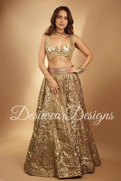 Made to Order/Measurement/Custom Order Lehenga - Color :  Gold - Fabric : crush tissue - Fully flared paneled lehenga - Embroidered  Blouse -  Net Dupatta with Gold Border - Drawstring closure with Tassels - - It can be customize in any design or size  PLEASE NOTE: BUYERS ARE RESPONSIBLE FOR ANY CUSTOMS AND IMPORT TAXES THAT MAY APPLY. This is a made to order product. If you opt for 'Made To Measurement Option', we will provide a measurement template and you can share the measurements likewise. If you want to opt for 'Standard Size', Please refer to the size chart provided in the listing. Shipping: Standard Shipping is done by DHL ecommerce and it mostly takes 2 to 3 weeks to deliver after dispatch. Express Shipping is done by DHL express and it mostly delivers within a week after dispatch Crush Tissue Lehenga, Festive Pre-draped Saree With Zari Work For Party, Glamorous Festive Pre-draped Saree For Celebration, Glamorous Wedding Pre-draped Saree With Pallu, Party Pre-draped Saree With Mirror Work In Art Silk, Semi-stitched Saree For Wedding And Party Season, Diwali Party Pre-draped Tissue Silk Saree, Party Wear Lehenga Shaped Like Saree For Reception, Pre-draped Tissue Silk Saree With Dupatta For Party