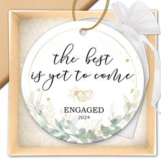 the best is yet to come engaged ornament in gold and white with greenery